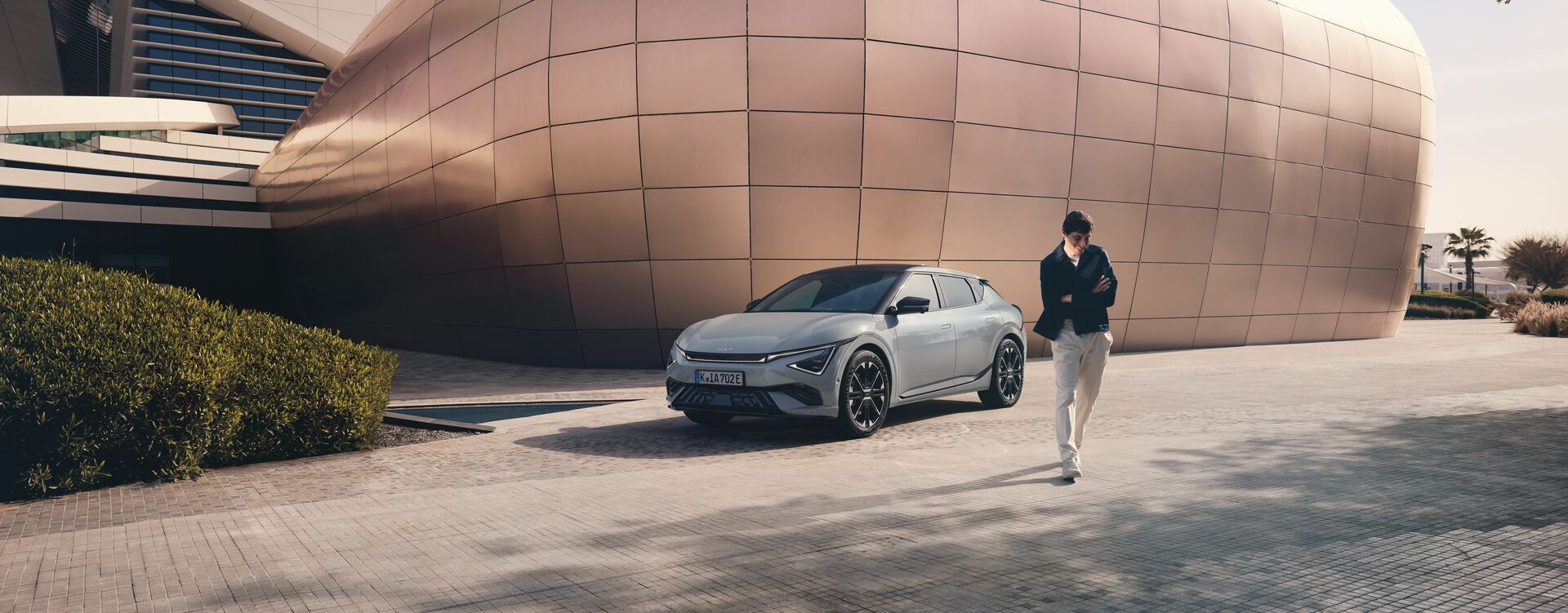 EV6 GTL MY25 Single Beauty Shot 34 Front with Talent CMYK